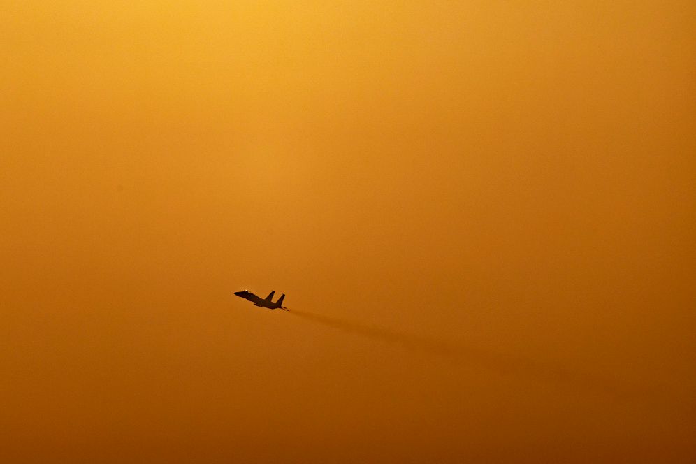 An Israeli Air Force fighter jet flies over central Israel amid the ongoing war between Israel, Iran and Hezbollah, March 12, 2026. 