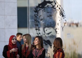 Visitors stand outside the tomb of late Palestinian leader Yasser Arafat during the opening of the Yasser Arafat Museum in the West Bank city of Ramallah, on November 9, 2016.