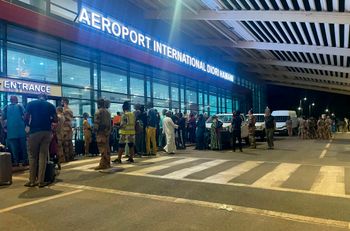 French and other European nationals wait outside of Niamey's Diori-Hamani international airport in Niger
