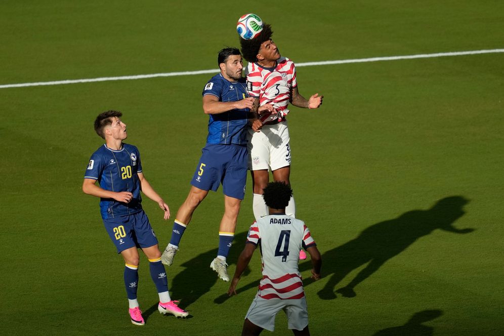 (AP Photo/Jeff Chiu) Bosnia's Sead Kolasinac (5) battles for a header with United States' Chris Richards (3) during the World Cup round of 32 soccer match between the United States and Bosnia in Santa Clara, Calif., near San Francisco, Wednesday, July 1, 2026.