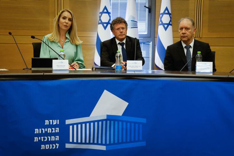 Director of the Elections Committee of the Knesset, Orly Adas (L), Yitzhak Amit, Chairman of the Election Committee (C) and Attorney Ilan Bombach, Vice Chairman of the Election Committee where political parties running for a spot in the upcoming Israeli elections arrive to present their party list, at the Knesset, the Israeli parliament, in Jerusalem, on September 14, 2022.