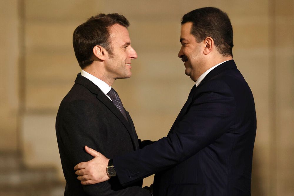 French President Emmanuel Macron (L) welcomes Iraqi Prime Minister Mohammed Shia al-Sudan in Paris, France, on January 26, 2023.