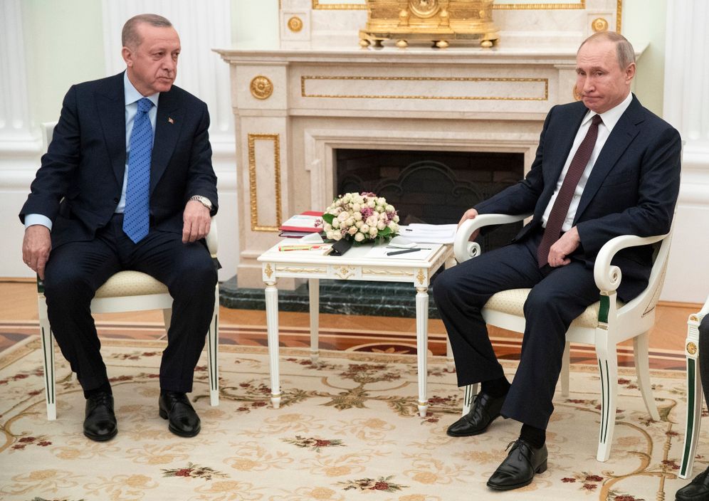 Russian President Vladimir Putin, right, and Turkish President Recep Tayyip Erdogan talk during their meeting in the Kremlin, in Moscow, Russia, Thursday, March 5, 2020.