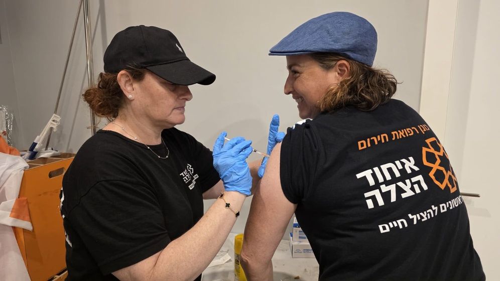 United Hatzalah Woman getting an adrenaline shot
