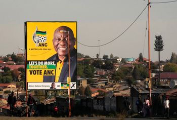 An election poster, with President Cyril Ramaphosa atop a pole in Soweto, South Africa