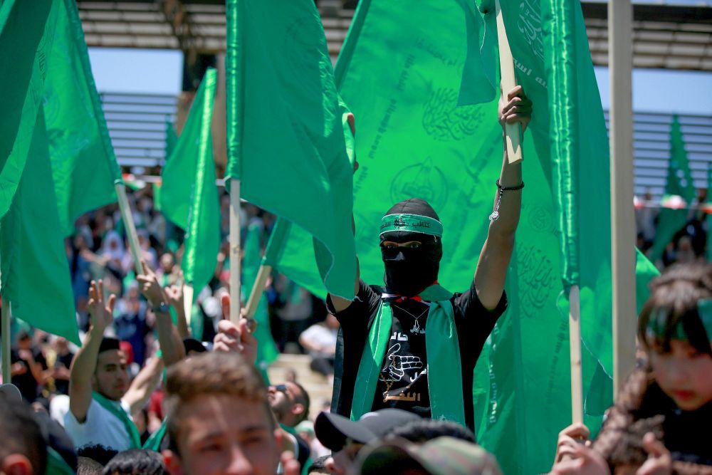 Des étudiants palestiniens partisans du mouvement Hamas lors d'un rassemblement à l'université de Birzeit, près de la ville cisjordanienne de Ramallah, le 19 mai 2022