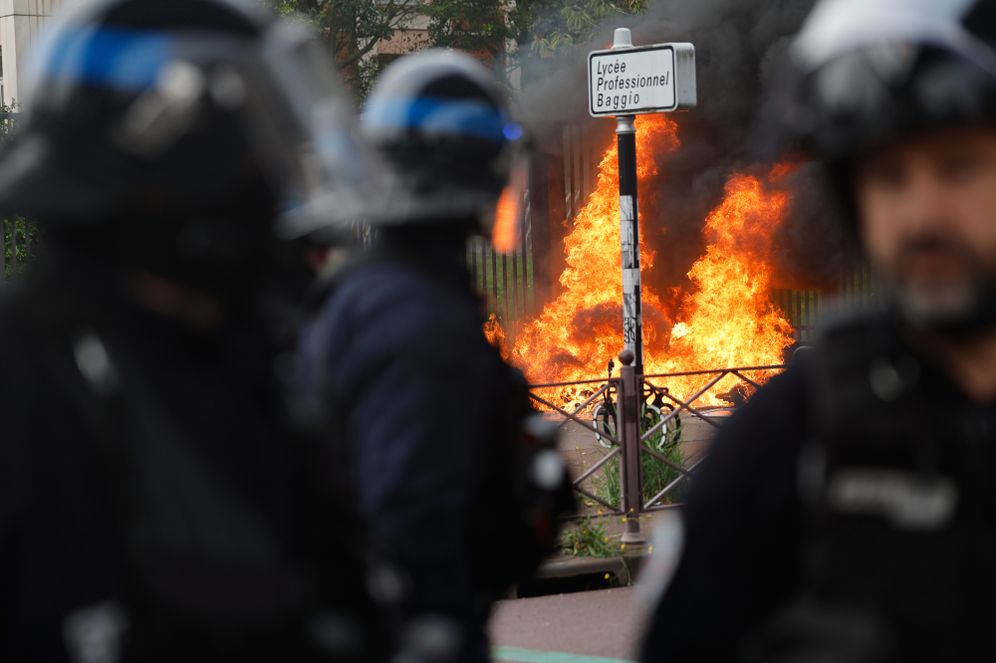 French police face students next to the entrance of Baggio High School, blocked in protest of the government's release of next year's draft budget, in Lille, France, Tuesday, Sept. 29, 2026. 
