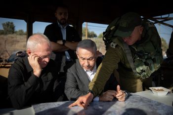 Israeli Prime Minister Benjamin Netanyahu and Israeli minister of Defense Yoav Galant visit at an army base near the West Bank city of Jenin.