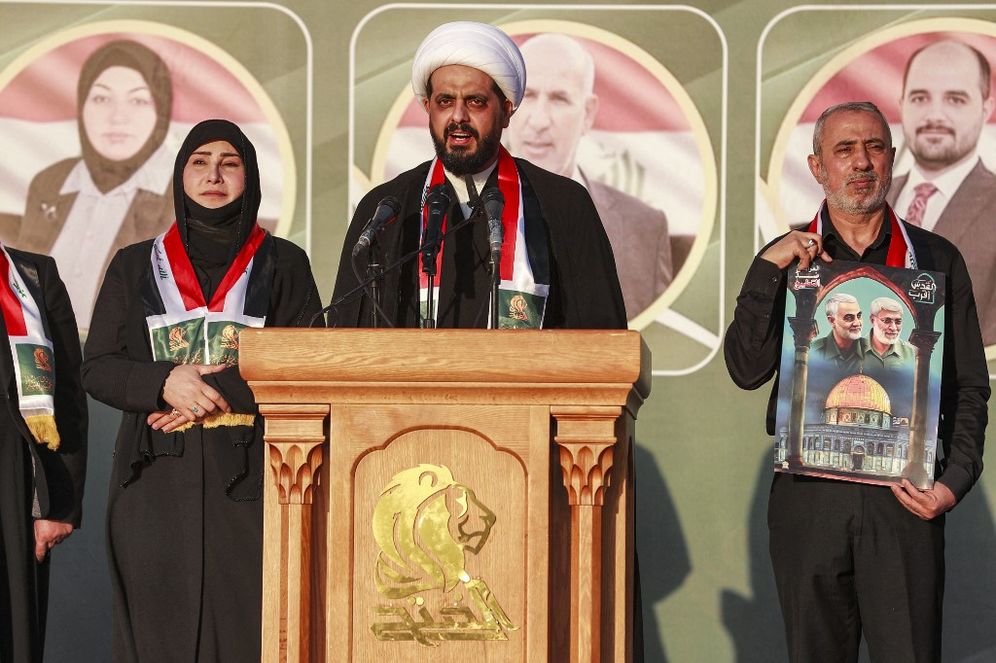 AHMAD AL-RUBAYE / AFP Qais al-Khazali (C), secretary-general of the "Asaib Ahl al-Haq" movement, speaks during an election rally in Iraq's capital Baghdad.
