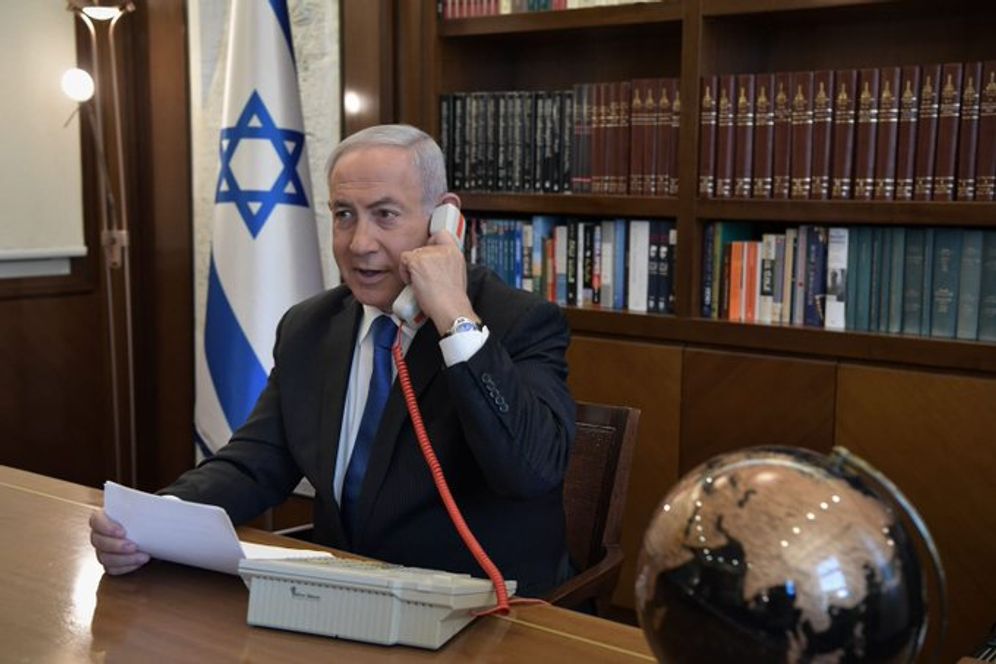 Israel's Prime Minister Benjamin Netanyahu speaks by telephone with US President Donald Trump and UAE Crown Prince Sheikh Mohammed bin Zayed on August 13, 2020