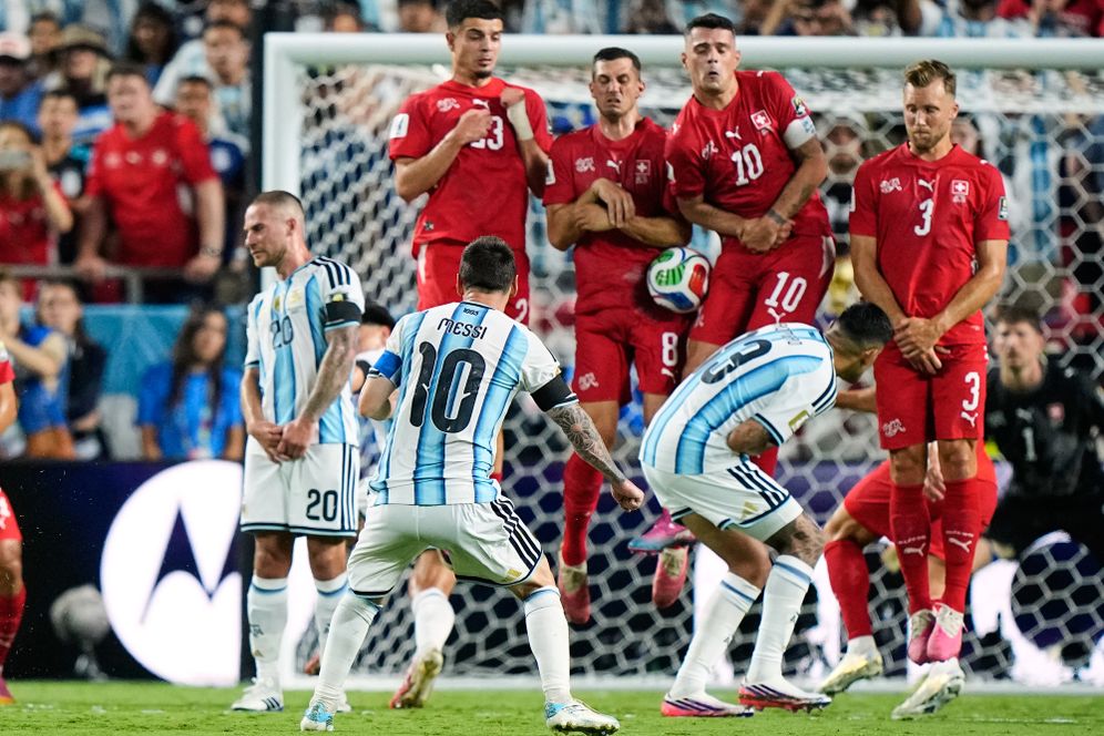 (AP Photo/Charlie Riedel) A free kick by Argentina's Lionel Messi (10) is blocked by Switzerland's Remo Freuler (8) and Granit Xhaka (10) during the World Cup quarterfinal soccer match in Kansas City, Mo., Saturday, July 11, 2026