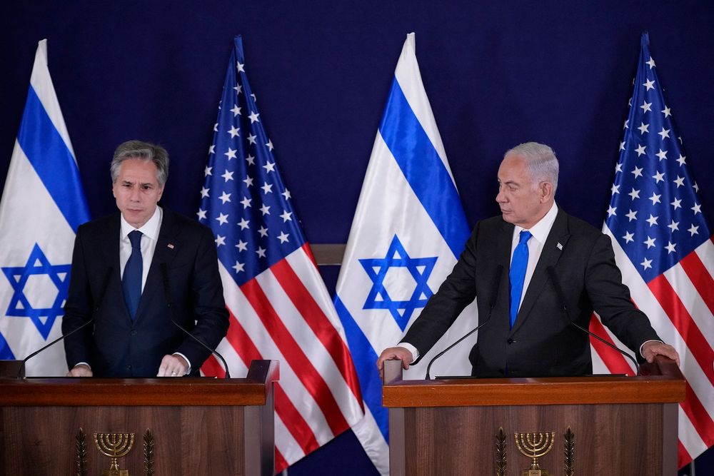 Israeli Prime Minister Benjamin Netanyahu (R) looks on as US Secretary of State Antony Blinken gives statements to the media.