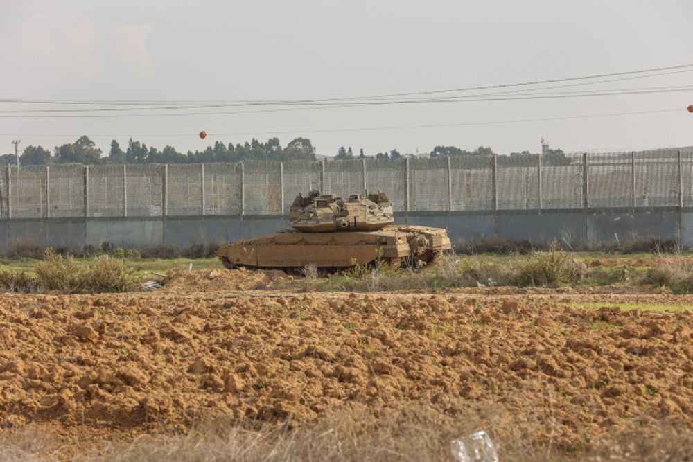 An Israeli tank guards the border between Israel and the Gaza Strip.