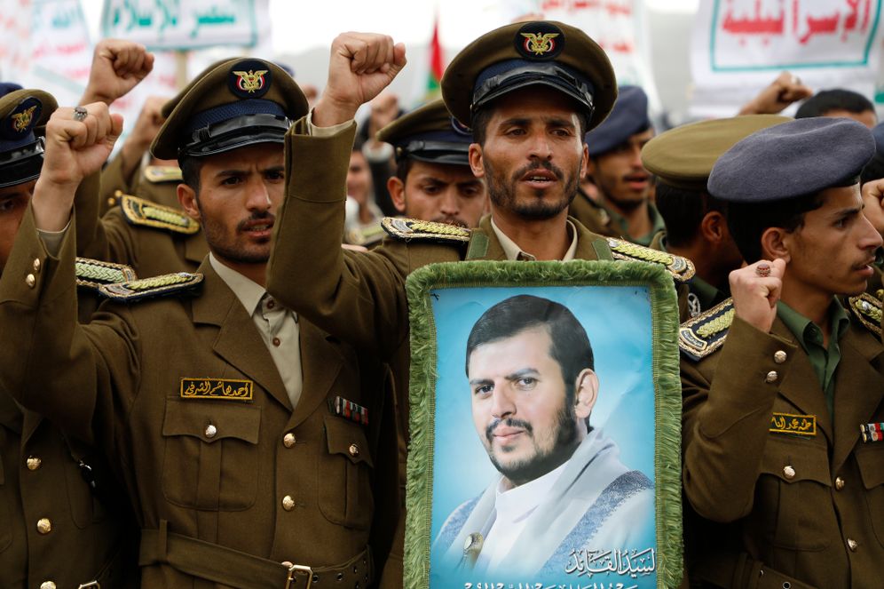 Houthi supporters hold up a portrait of leader Abdul-Malik Badruldeen al-Houthi during a rally against the US-led strikes and in the support of Palestinians in the Gaza Strip, in Sanaa, Yemen