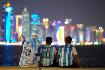 Fans of Argentina sit on Doha corniche, in Doha, Qatar, on December 12, 2022.