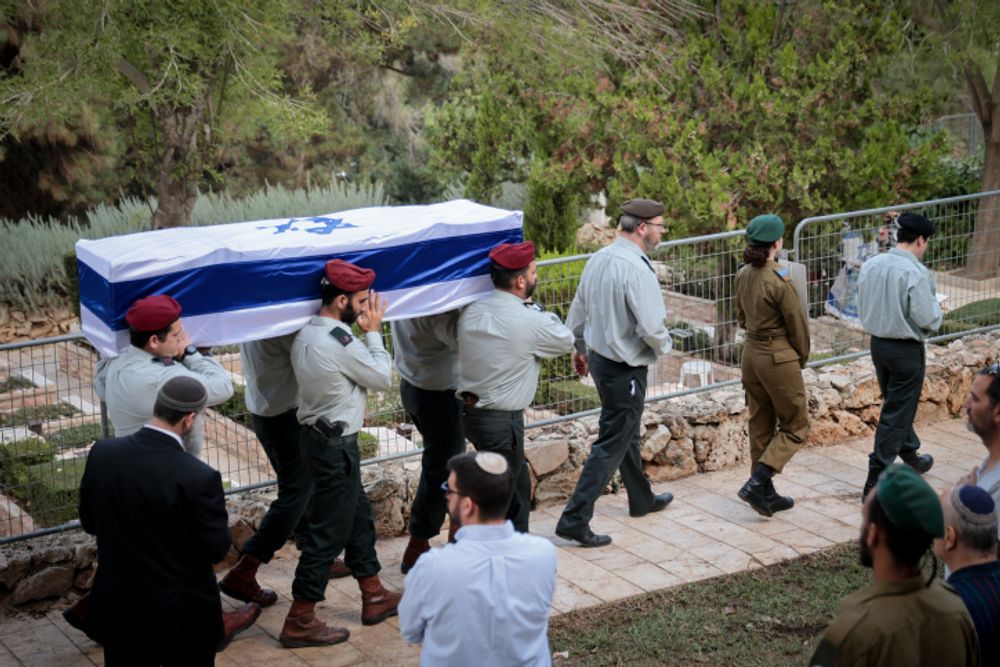 Family and friends attend the funeral of Israeli soldier Tal Cohen at Mt Herzl cemetary in Jerusalem.