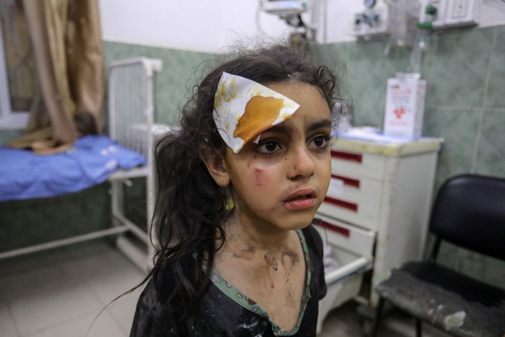 Palestinian medics transport injured Palestinians, in Rafah, in the southern Gaza Strip, on August 6, 2022.