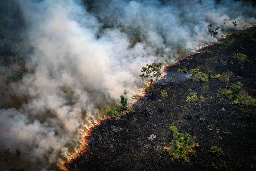 Aerial view of a burning area in the Amazon rainforest, near the Lago do Cunia Extractive Reserve, on the border of the states of Rondonia and Amazonas, northern Brazil, on August 31, 2022.