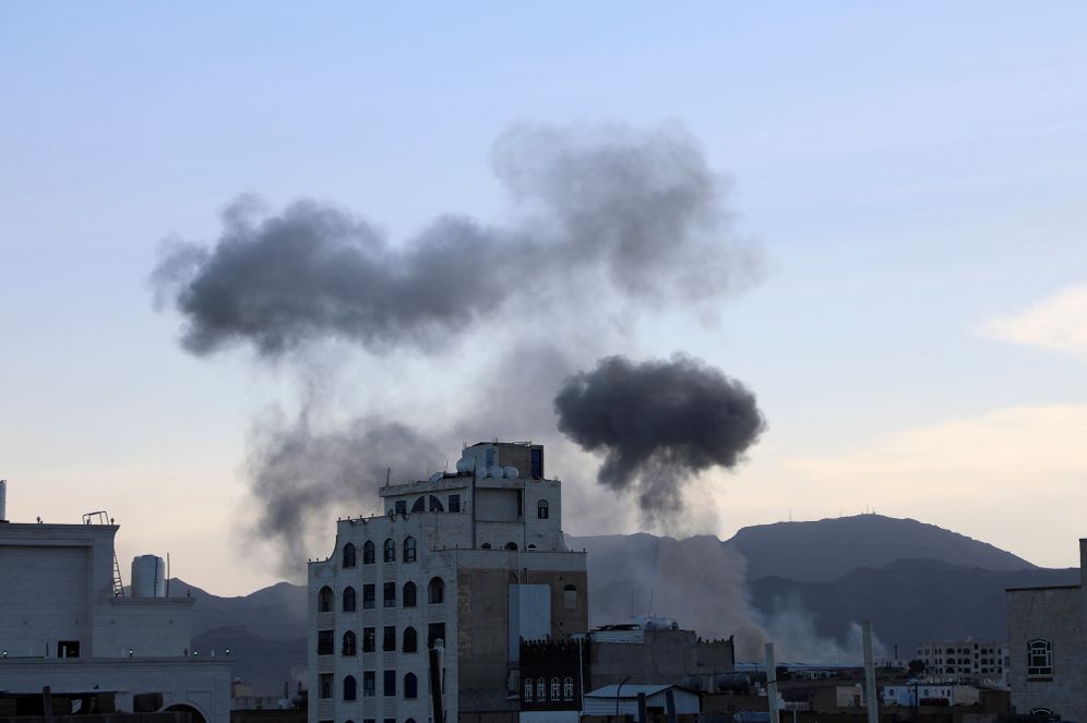 Smokes raise after US aircraft and ships struck Houthi strongholds, according to the official, in Sanaa, Yemen