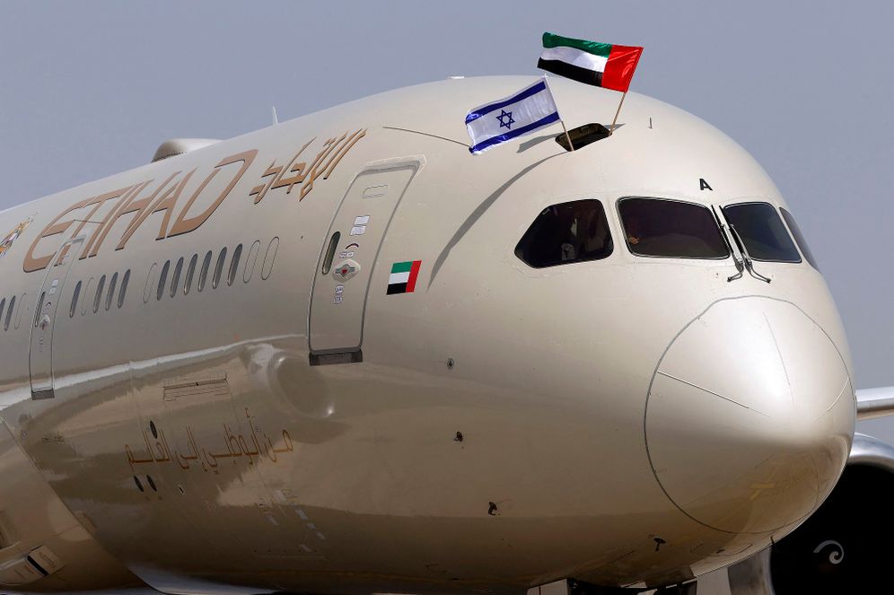 An Etihad Airways Boeing 787-9 "Dreamliner" aircraft displays Israeli and Emirati flags after landing upon arrival from the United Arab Emirates (UAE) at Israel's Ben Gurion Airport near Tel Aviv, on the company's first scheduled commercial flight from Abu Dhabi, on April 6, 2021.