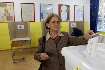 A voter casts her ballot at a polling station in Banja Luka, Bosnia and Herzegovina on October 2, 2022.