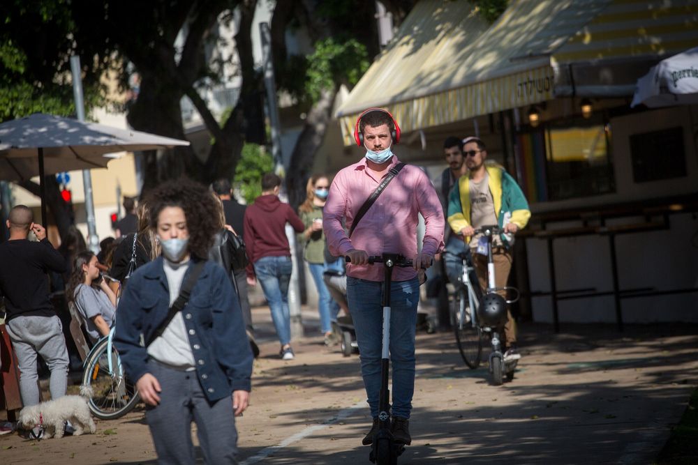 Israelis on Rothschild Boulevard in Tel Aviv, as Israel exits a third lockdown during the COVID-19 pandemic, on February 7, 2020.