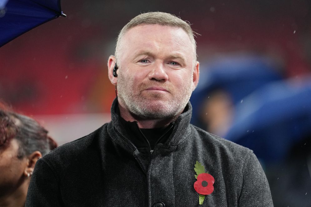 (AP Photo/Jon Super) Former start striker Wayne Rooney stands on thne pitch before the Champions League soccer match between Liverpool and Real Madrid in Liverpool, England, Tuesday, Nov. 4, 2025.