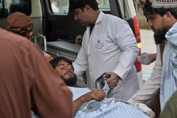 A wounded man arrives in an ambulance following border clashes between Afghan Taliban and Pakistani forces, at Mirwais hospital in Kandahar, Afghanistan, on February 24, 2022.
