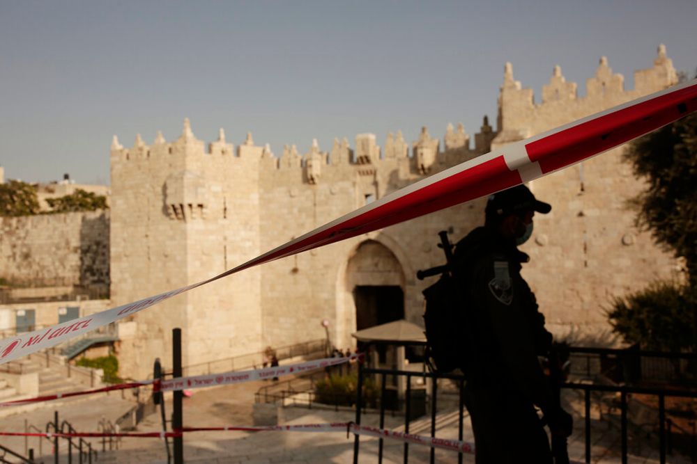 An Israeli Border Police officer blocks off an entrance to Damascus Gate in the Old City of Jerusalem.