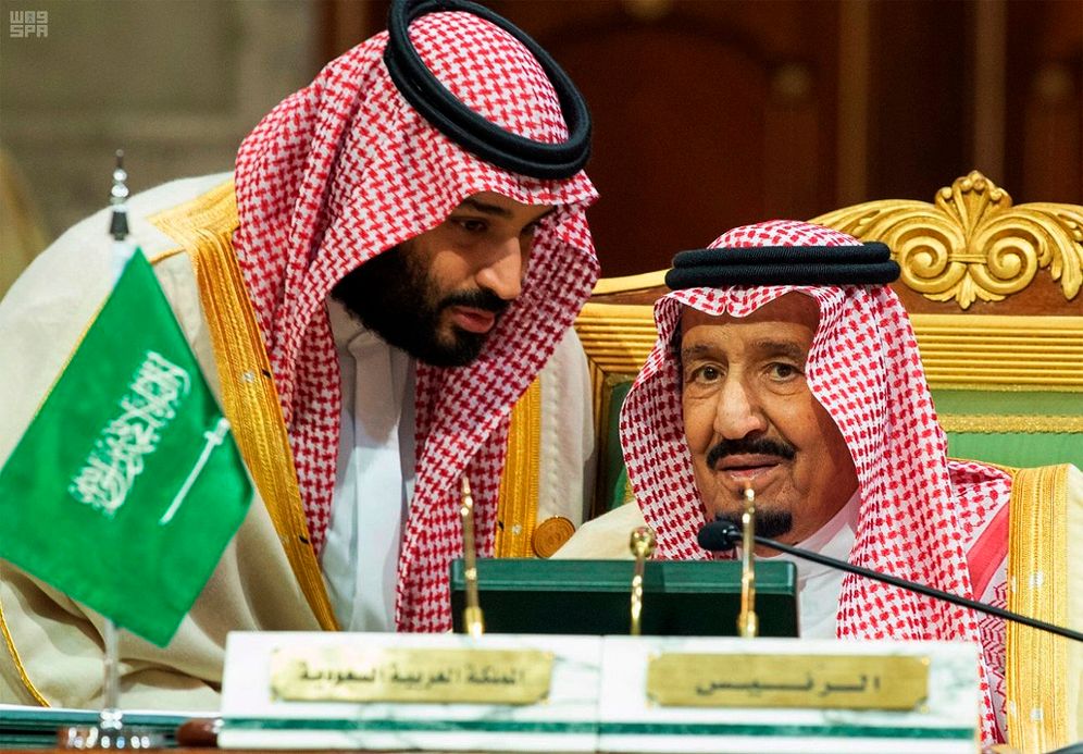 Saudi Crown Prince Mohammed bin Salman, (left,) speaks to his father, King Salman, at a meeting of the Gulf Cooperation Council in Riyadh, Saudi Arabia, on December 9, 2018.