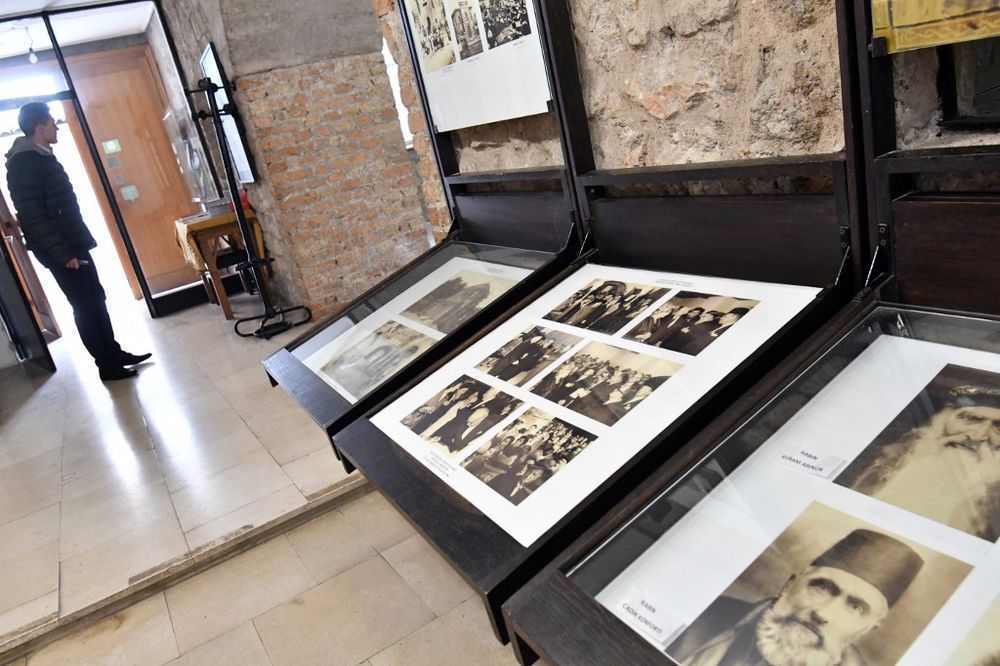 This photograph taken on February 22, 2018, shows a visitor looking at exhibits at a former Jewish temple in Sarajevo, Bosnia and Herzegovina, which was repurposed into the Museum of Jewish Victims of WWII.