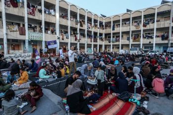 Displaced Palestinians eat iftar at Taha Hussein School during the Muslim's holy fasting month of Ramadan, in the city of Rafah, south of the Gaza Strip, amid the battles between Israel and Hamas, on March 31, 2024.