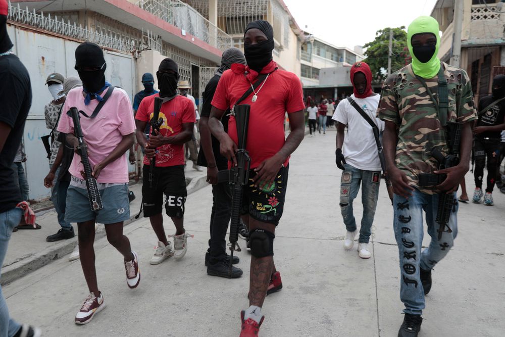 Armed members of "G9 and Family" march in a protest against Haitian Prime Minister Ariel Henry in Port-au-Prince, Haiti.