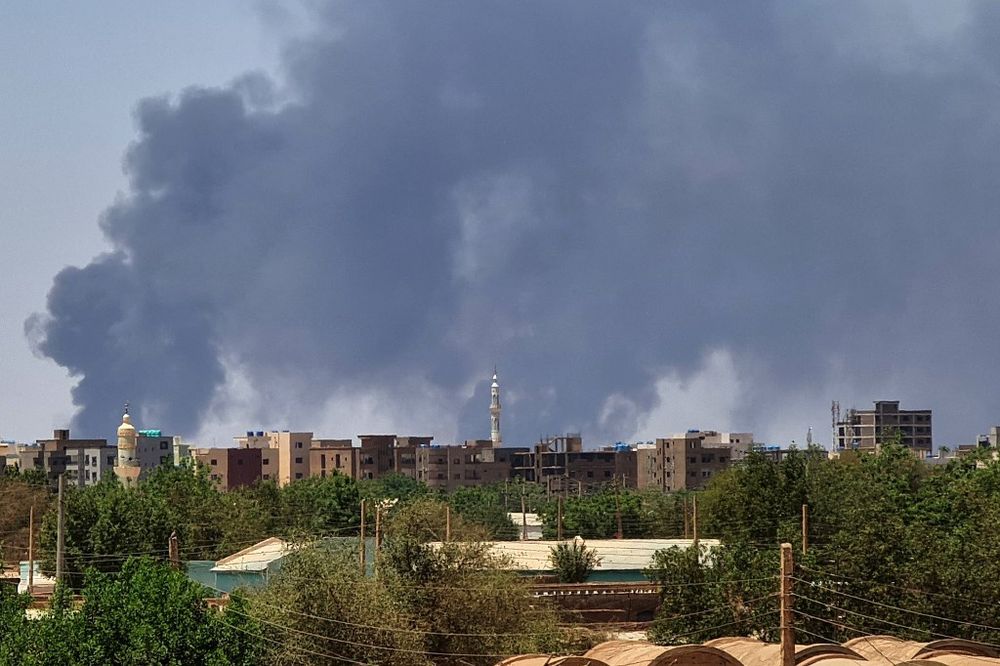 Smoke billows over buildings in Khartoum, Sudan.