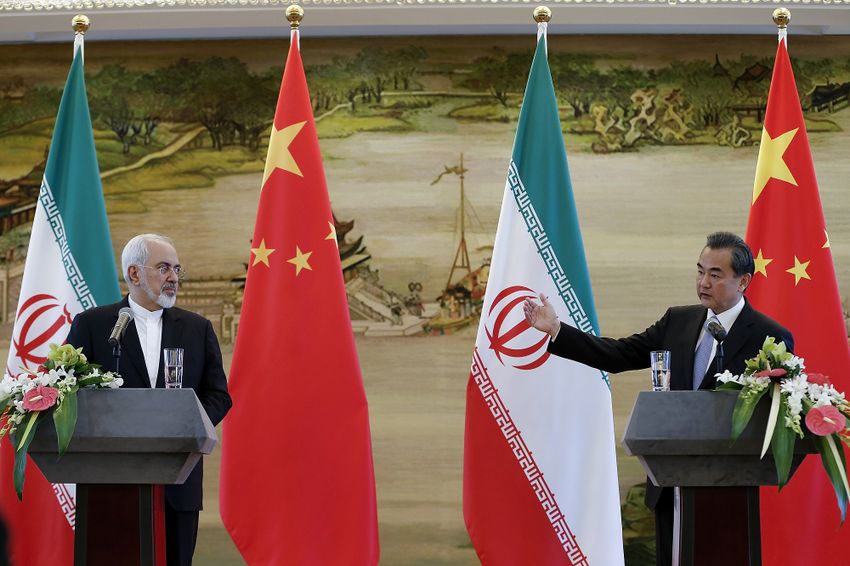 Chinese FM Wang Yi, right, and Iranian FM Mohammad Javad Zarif attend a joint press conference Tuesday, Sept. 15, 2015 in Beijing, China