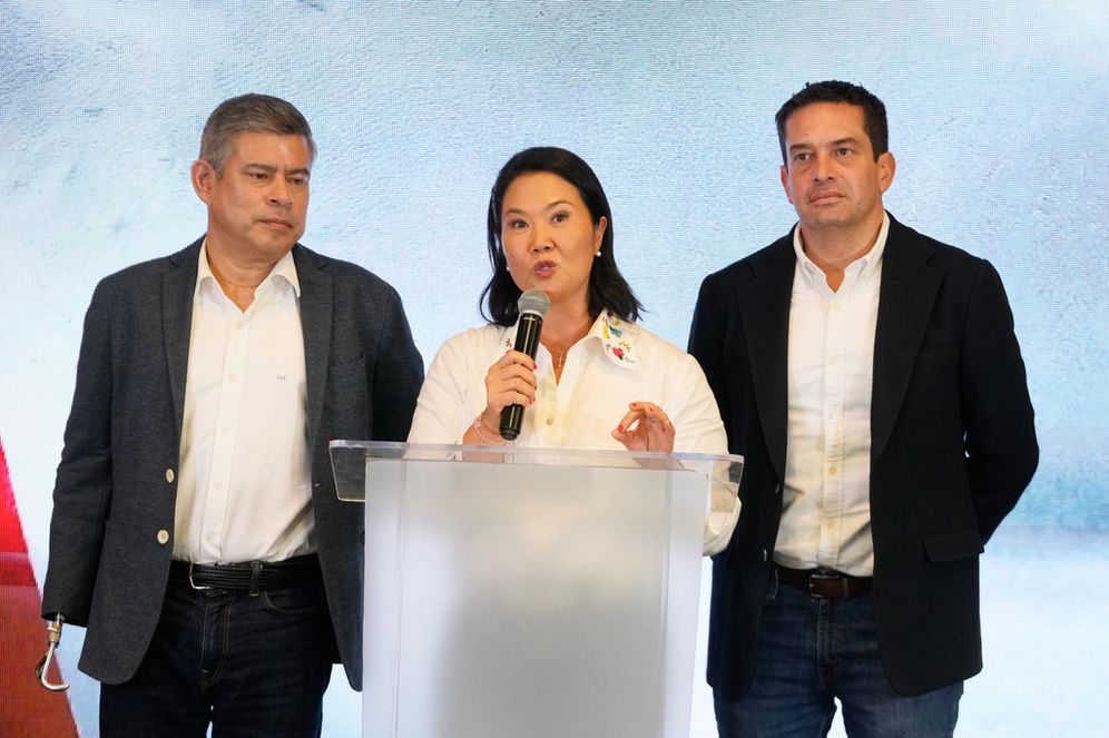 Presidential candidate Keiko Fujimori of the Popular Force party speaks alongside her vice-presidential running mate, Luis Galarreta, left, and Sen.-elect Miguel Angel Torres after polls closed in the presidential runoff election in Lima, Peru, Sunday, June 7, 2026. 