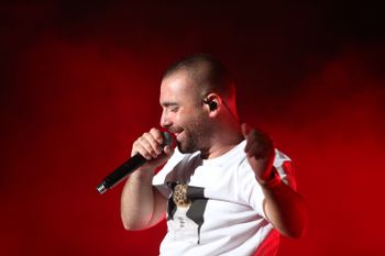 Israeli singer Omer Adam performs live at the annual Kleizmer Festival in the northern Israeli city of Tzfat, on August 14, 2019.