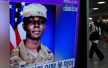 A TV screen shows a file image of U.S. soldier Travis King in Seoul, South Korea.