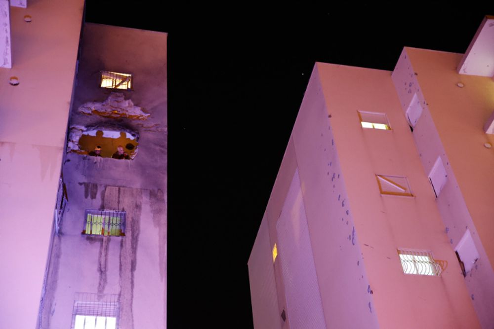 The scene where a rocket fired by Hamas militants from the Gaza Strip hit a residential building in the southern Israeli town of Sderot, seriously injuring a young boy. May 12, 2021.