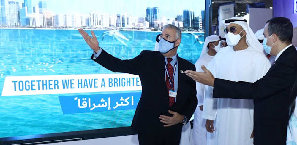 Abu Dhabi Crown Prince Sheikh Mohammed bin Zayed al-Nahyan (C) is given a tour of the Israeli pavilion at the Dubai Airshow's defense exhibition in Dubai, the United Arab Emirates, on November 17, 2021.