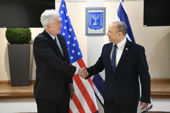Israel's Prime Minister Naftali Bennett (right) greets CIA Director William Burns in Jerusalem, on August 11, 2021.