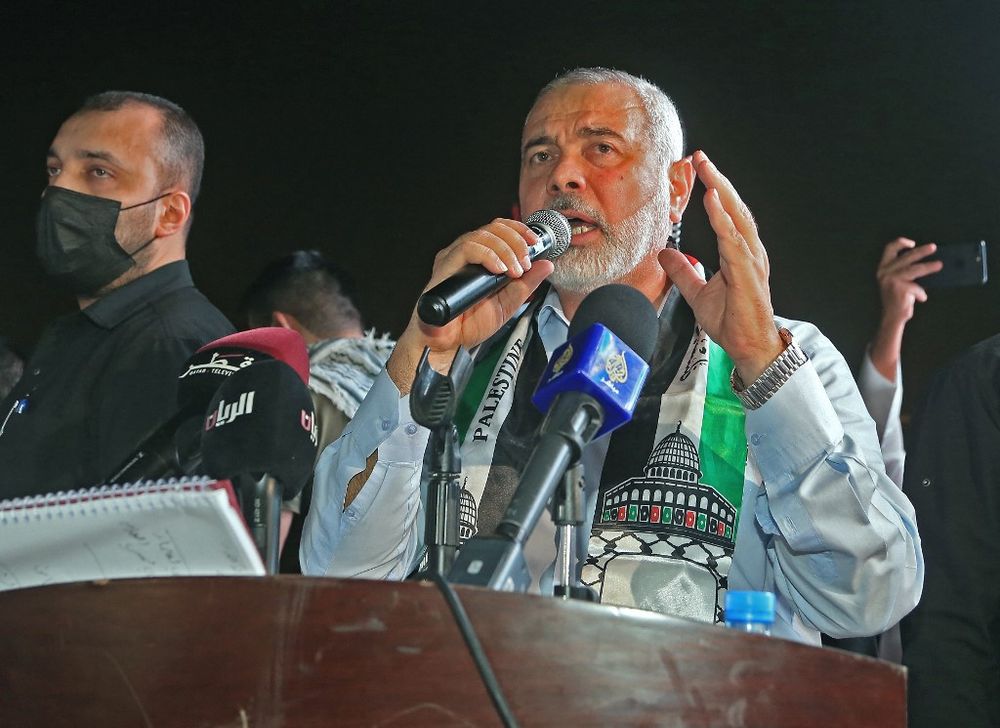 Hamas Political Bureau Chairman Ismail Haniyeh addresses supporters during a rally in solidarity with the Palestinians in Doha, Qatar, on May 15, 2021.
