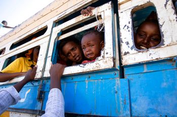 Refugees who fled the conflict in Ethiopia's Tigray region ride a bus in Hamdayet, eastern Sudan.