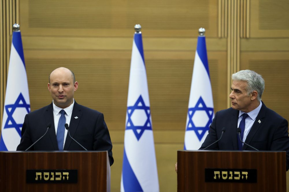 Israeli Prime Minister Naftali Bennett and Foreign Minister Yair Lapid hold a joint press conference at the Israeli parliament in Jerusalem on June 20, 2022.