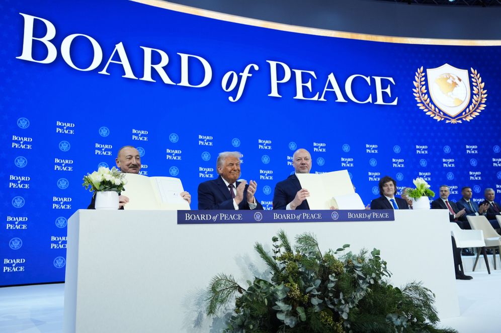 AP Photo/Evan Vucci FILE - President Donald Trump, center, applauds as Ilham Aliyev, President of Azerbaijan, left, and Bulgaria's Prime Minister Rossen Jeliazkov, right, hold up their signed Board of Peace charter during the Annual Meeting of the World Economic Forum in Davos, Switzerland, Jan. 22, 2026.