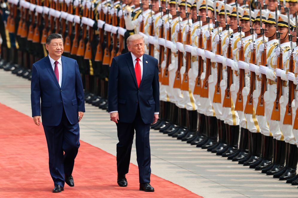 Chinese President Xi Jinping inspects an honor guard with U.S. President Donald Trump during a welcome ceremony at the Great Hall of the People in Beijing, Thursday, May 14, 2026. 
