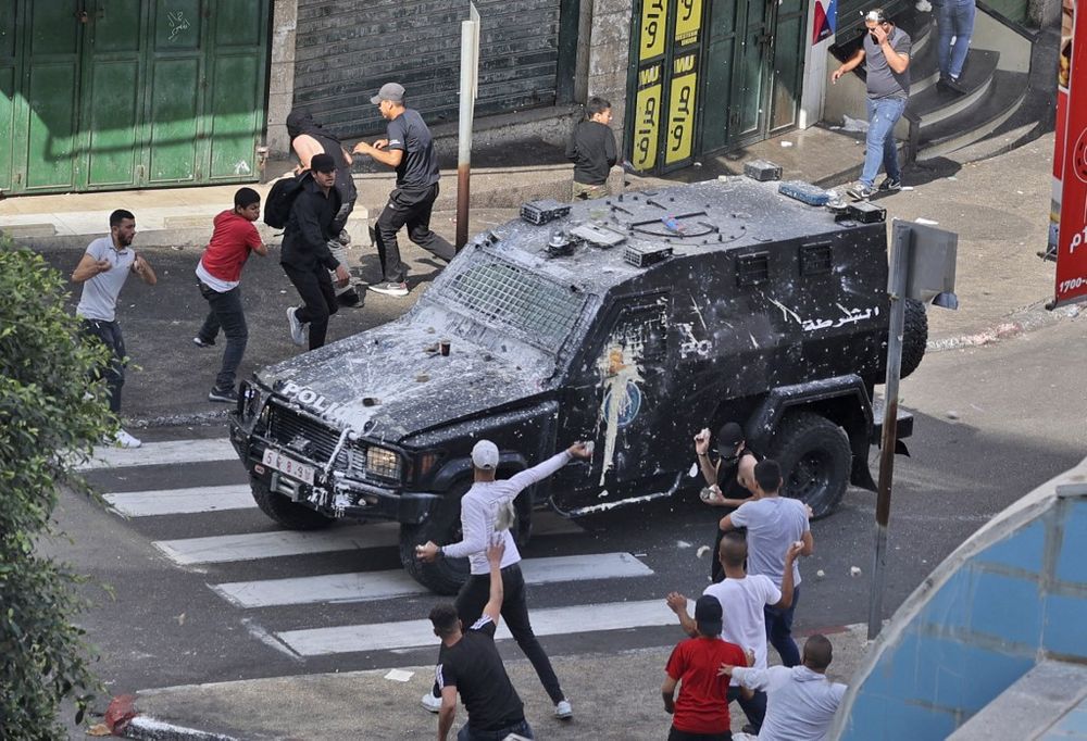 Palestinian protesters clash with Palestinian security forces in Nablus in the West Bank on September 20, 2022.