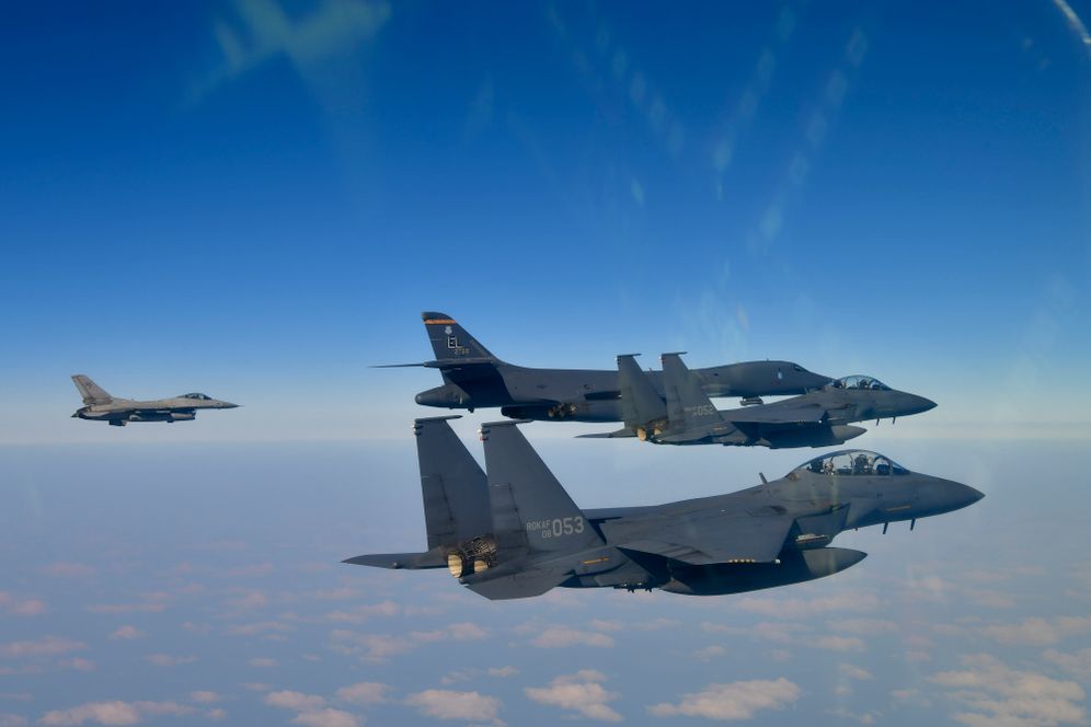 In this photo provided by the South Korea Defense Ministry, U.S. Air Force B-1B bomber, top second from left, F-16 fighter jet and South Korean Air Force F-15K fighter jets, right bottom, fly over the Korean Peninsula, South Korea during a joint aerial drill between South Korea and the United States, Thursday, Feb. 20, 2025. 
