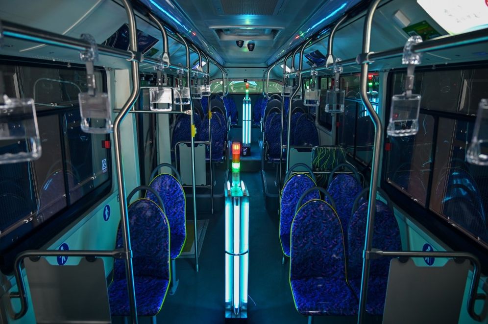 AFP / HECTOR RETAMAL A bus is disinfected using ultraviolet rays in Shanghai, China, on March 12, 2020.