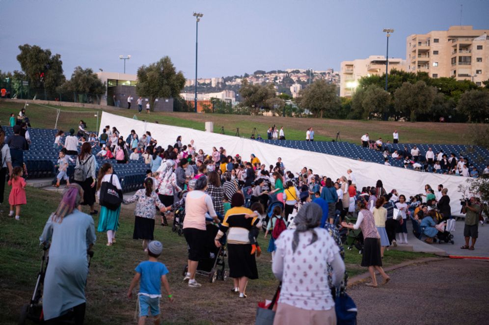 Ultra-Orthodox Jews attend a concert featuring ultra-Orthodox singer, Motti Steinmetz, in a show that has separation between men and women in the audience, in the northern Israeli city of Afula.